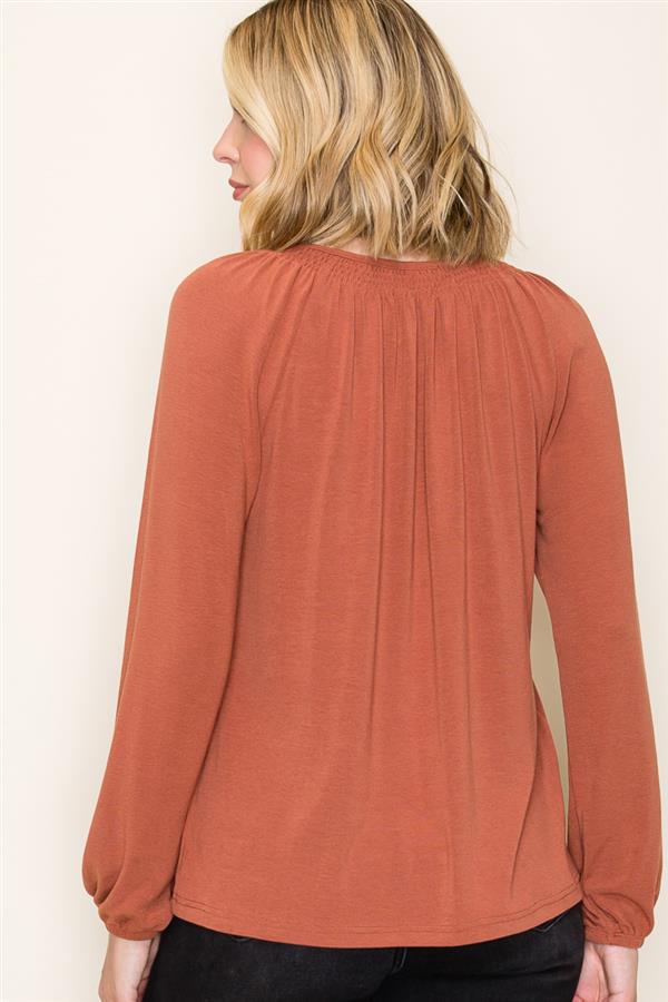 rust colored longsleeve blouse