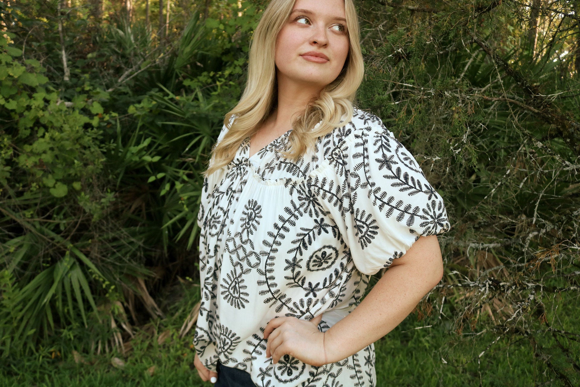 black and white patterned blouse with balloon sleeves
