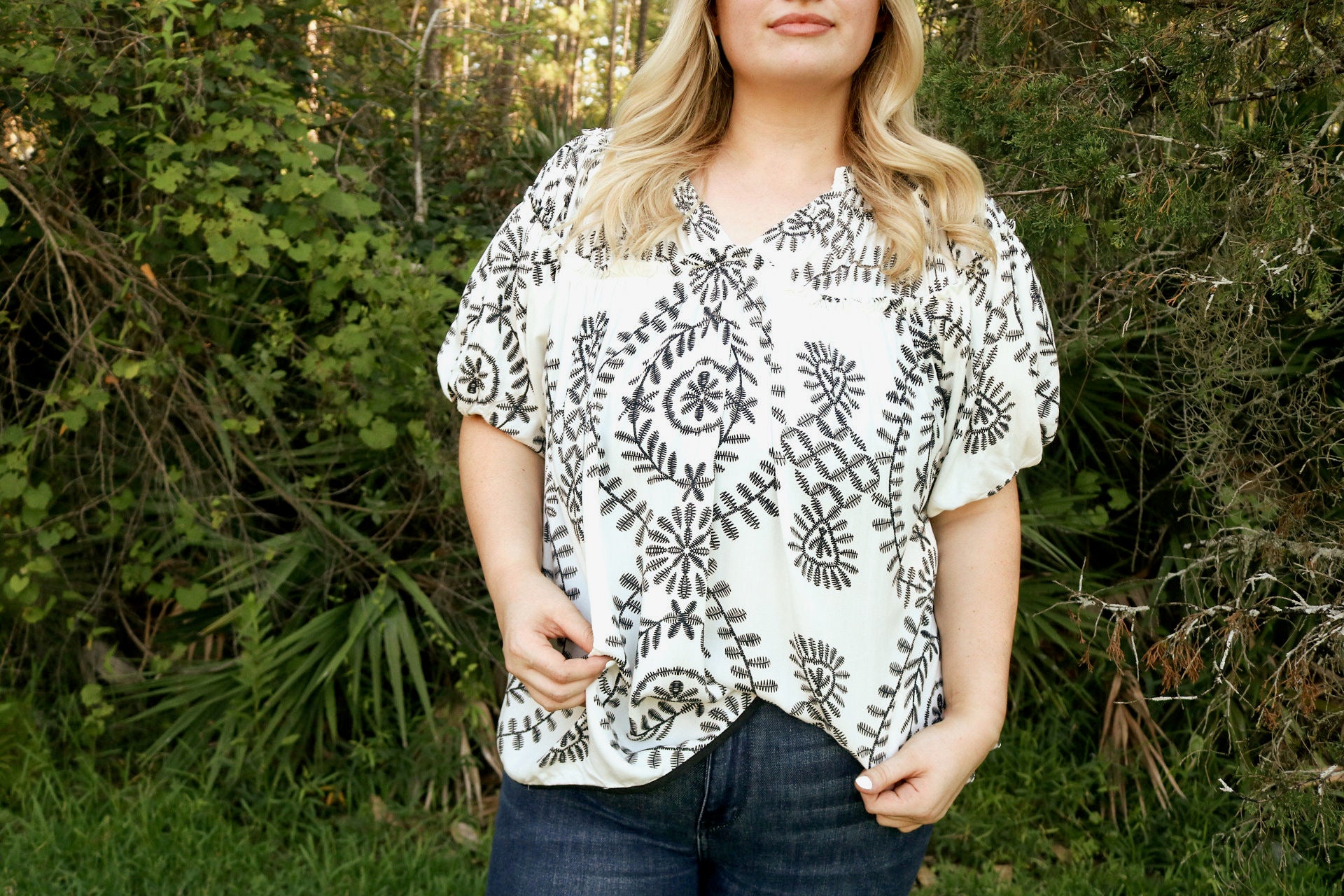 black and white patterned blouse with balloon sleeves
