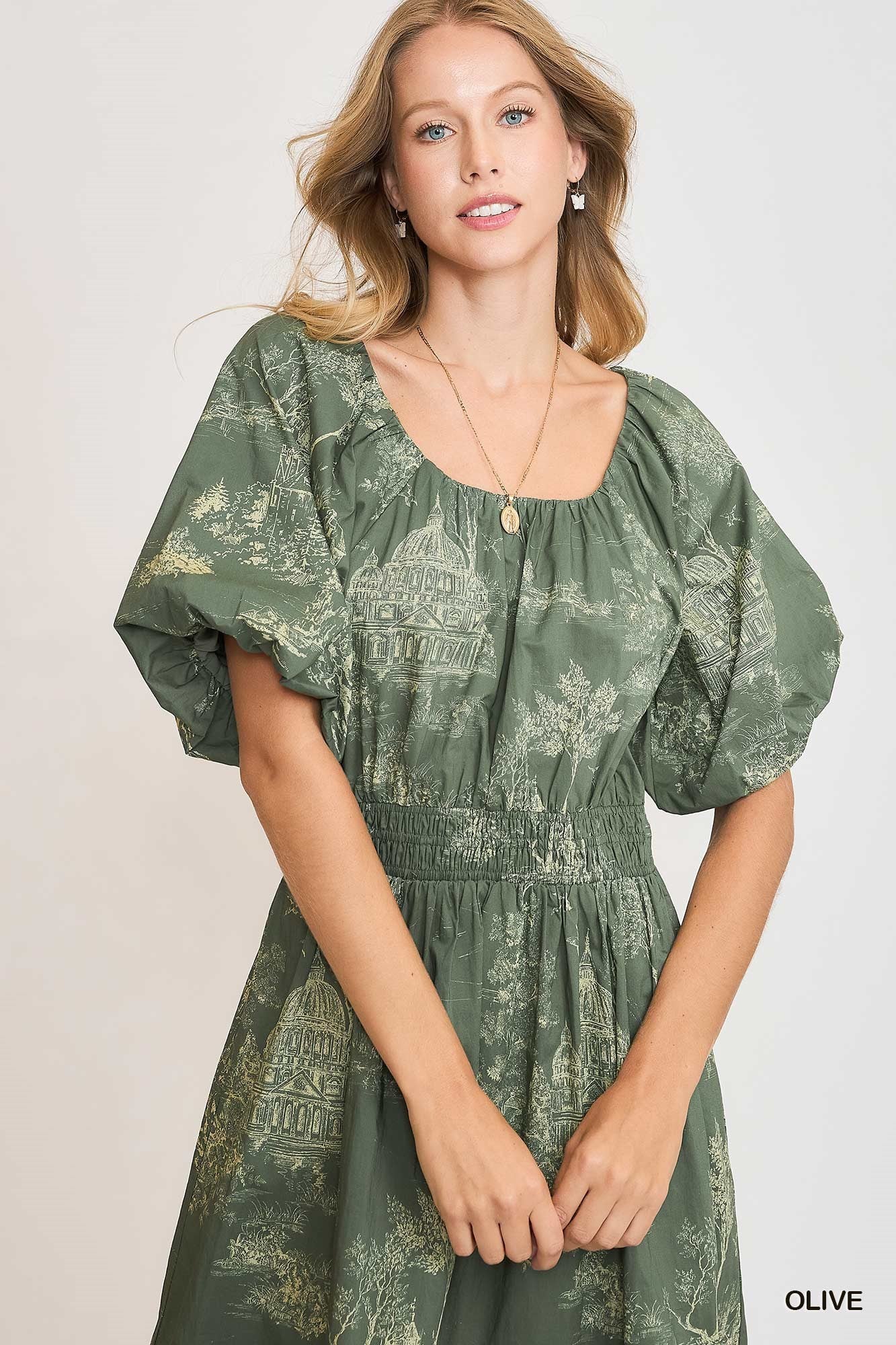 long green dress with puff sleeves