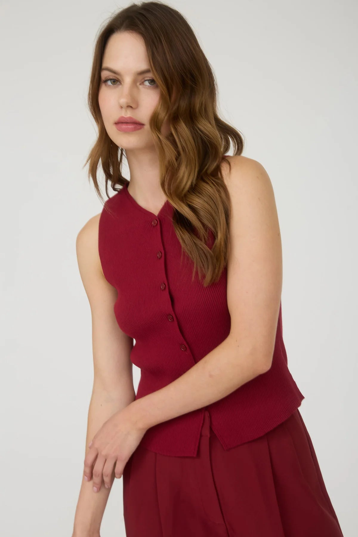 red sleeveless top with buttons