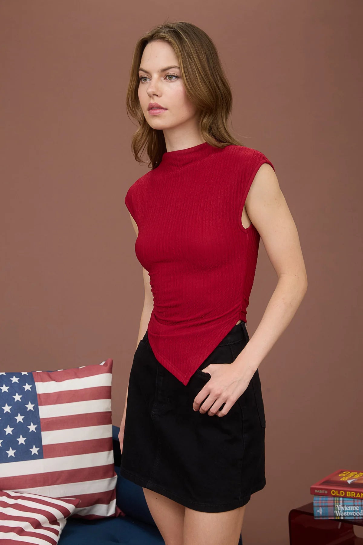 sleek mock neckline and a sleeveless silhouette