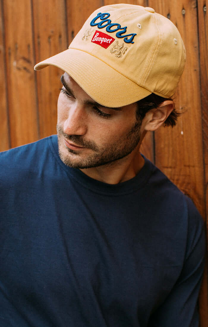Yellow Trucker hat with coors logo 