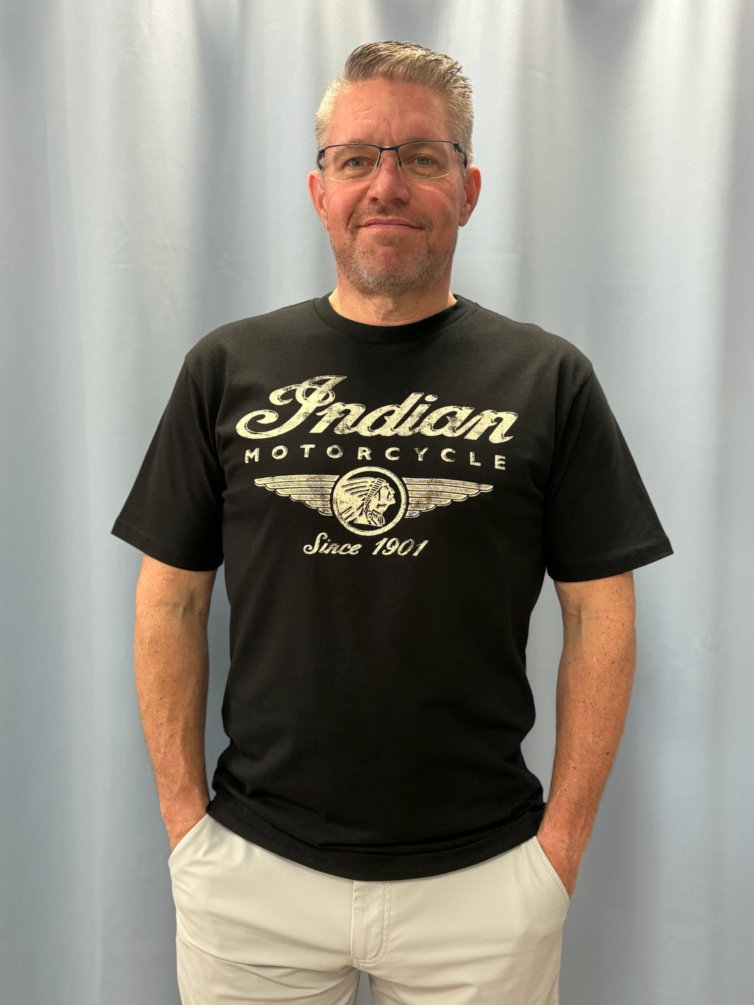 Man wearing a black t-shirt with &