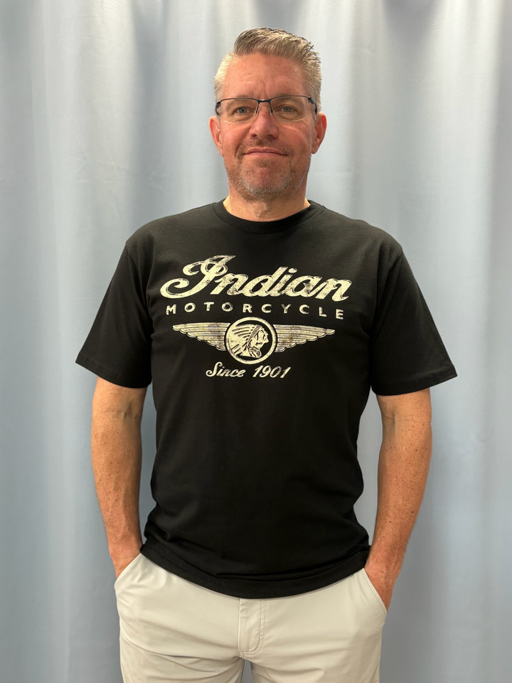 Man wearing a black t-shirt with &