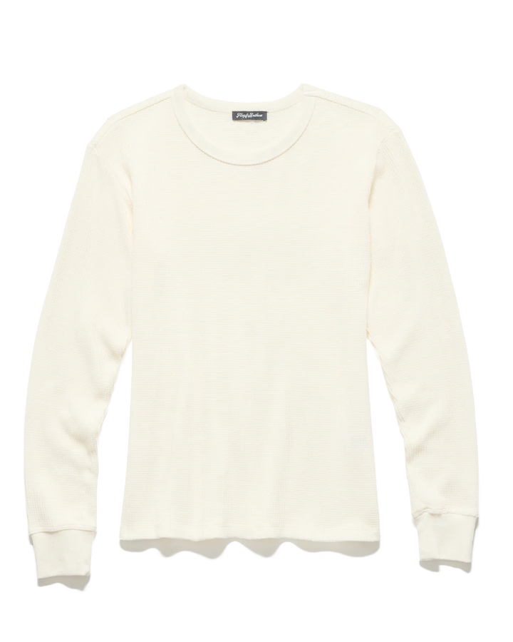 White sweater with a brand label on a white background