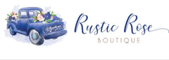Blue Truck with flowers on it and with words Rustic Rose Boutique to the right of the truck