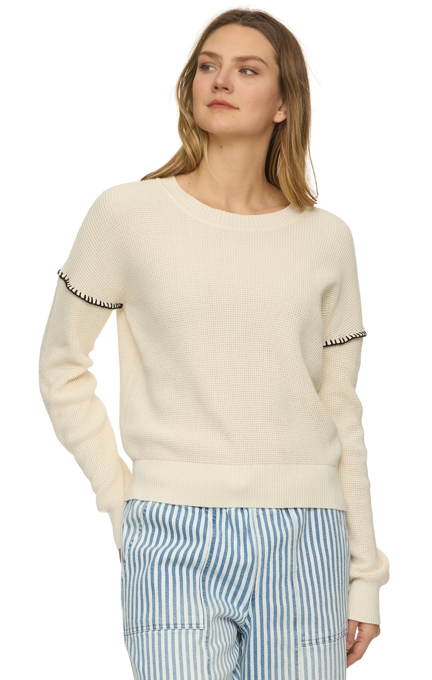 cream sweater with whip stitch 
